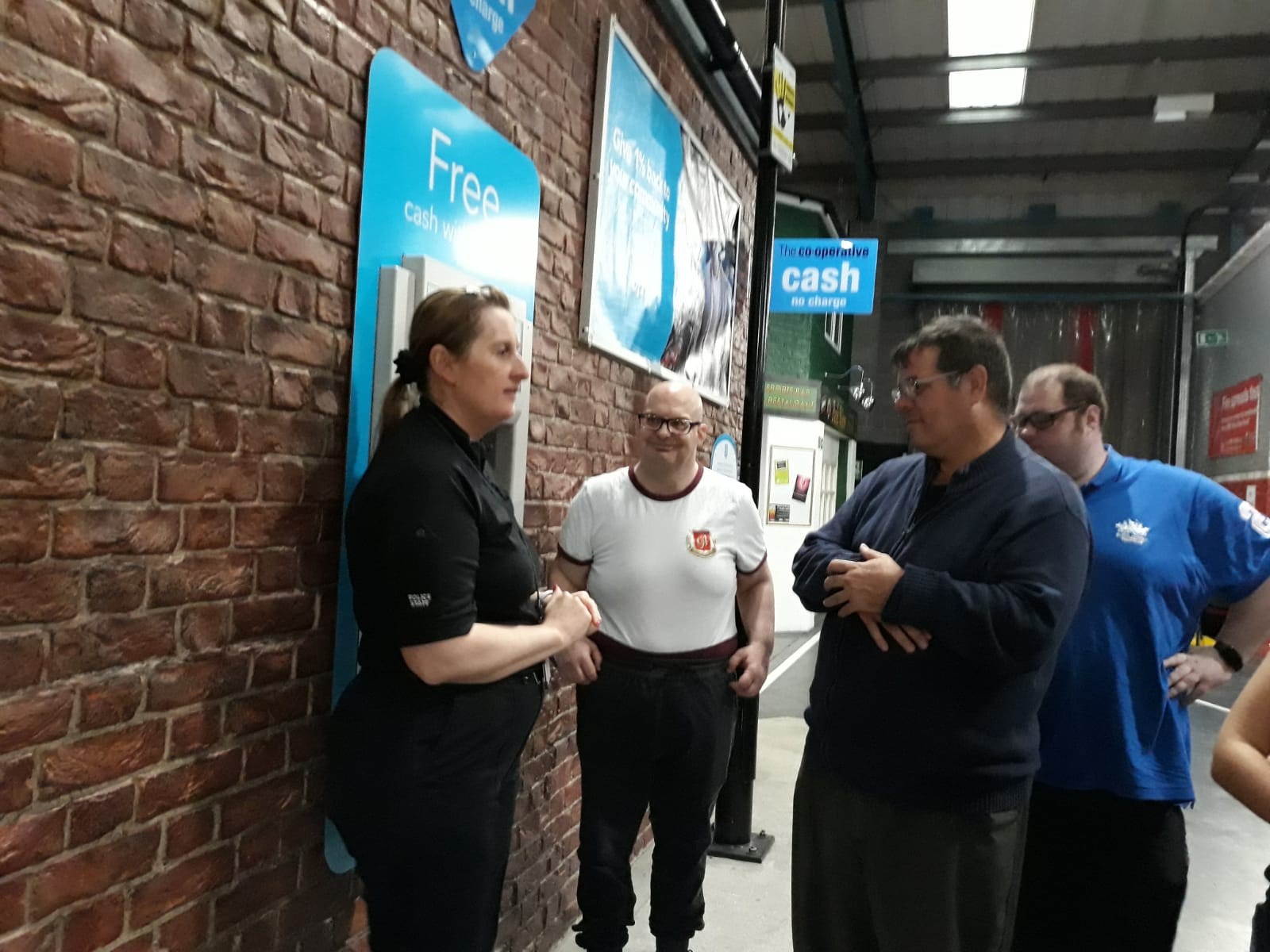 A woman stood up speaking to a group of people