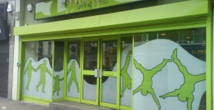 A green coloured shop front