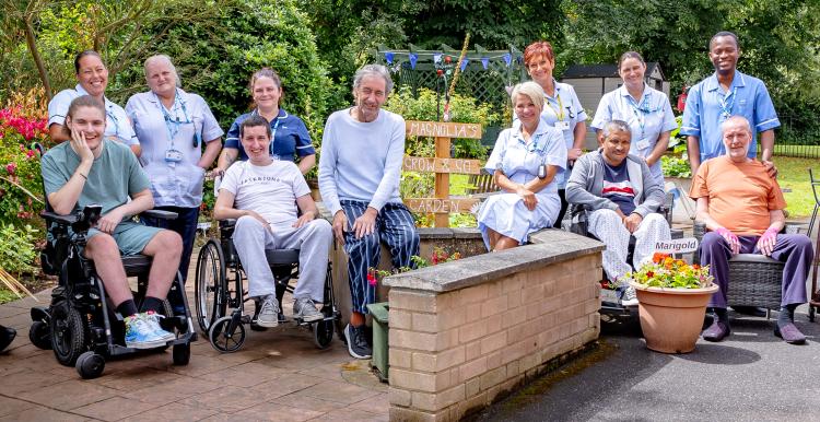 Patients and colleagues in the garden at Magnolia Lodge