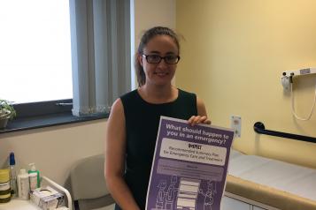 Woman holding a poster