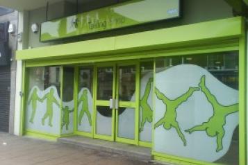 A green coloured shop front