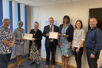 Dr Rum Thomas and Dr Shirley Spoors celebrating their completion of the programme with members of the Board of Directors at DBTH.